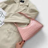 Monika. ™ ｜Lackad läderväska