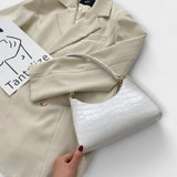 Monika. ™ ｜Lackad läderväska